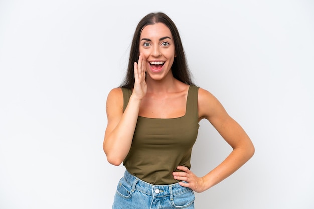 Young caucasian woman isolated on white background with surprise and shocked facial expression