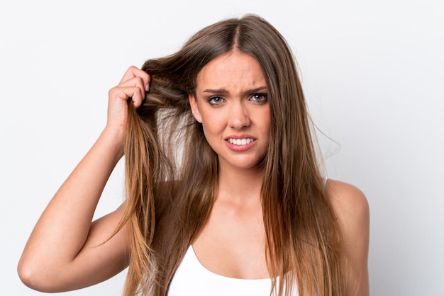 Young caucasian woman isolated on white background with tangled hair Close up portrait