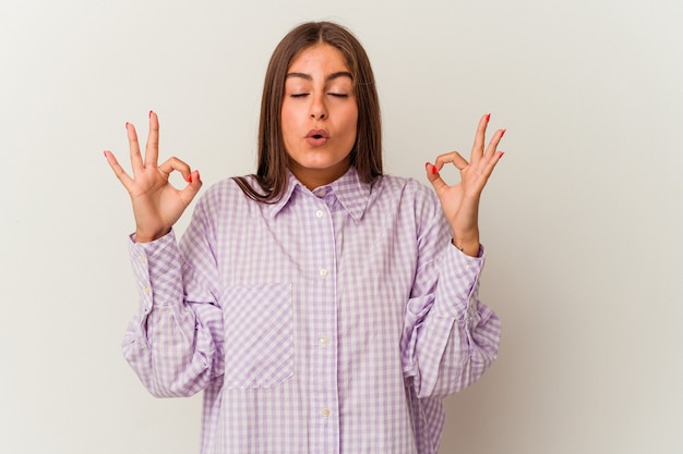 Young caucasian woman isolated on white wall yawning showing a tired gesture covering mouth with hand.