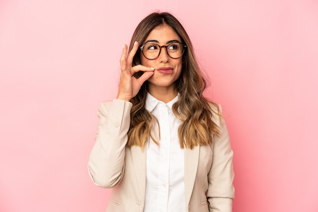 Young caucasian woman isolated with fingers on lips keeping a secret