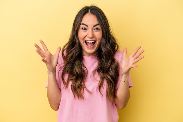 Young caucasian woman isolated on yellow background screaming to the sky looking up frustrated