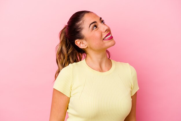 Young caucasian woman looking up