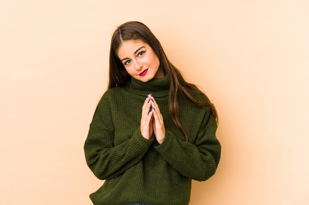 Young caucasian woman making up plan in mind, setting up an idea.