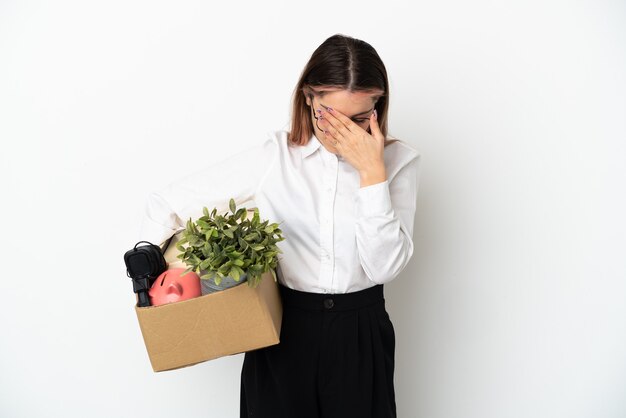 Young caucasian woman moving in new home among boxes isolated on white background with tired and sick expression