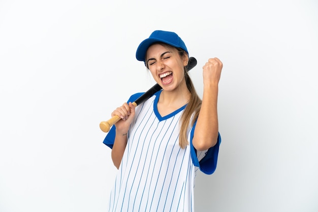 Young caucasian woman playing baseball isolated on white background celebrating a victory