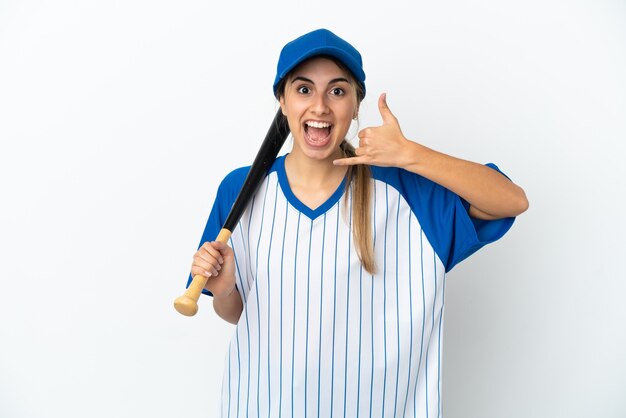 Young caucasian woman playing baseball isolated on white background making phone gesture. Call me back sign