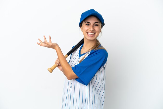 Young caucasian woman playing baseball isolated on white wall extending hands to the side for inviting to come