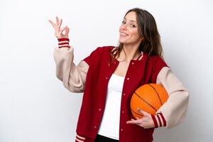 Photo young caucasian woman playing basketball isolated on white background extending hands to the side for inviting to come