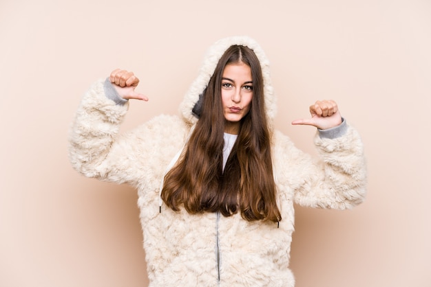 Young caucasian woman posing isolated feels proud and self confident, example to follow.