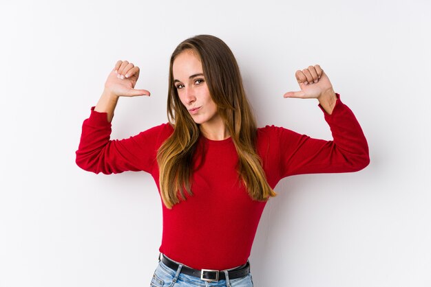 Young caucasian woman posing isolated  feels proud and self confident, example to follow.