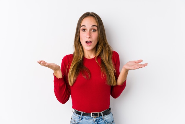 Young caucasian woman posing isolated  surprised and shocked.