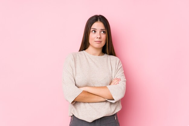 young caucasian woman posing isolated tired of a repetitive task.