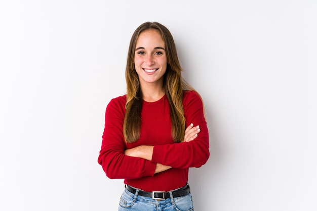 Young caucasian woman posing isolated  who feels confident, crossing arms with determination.