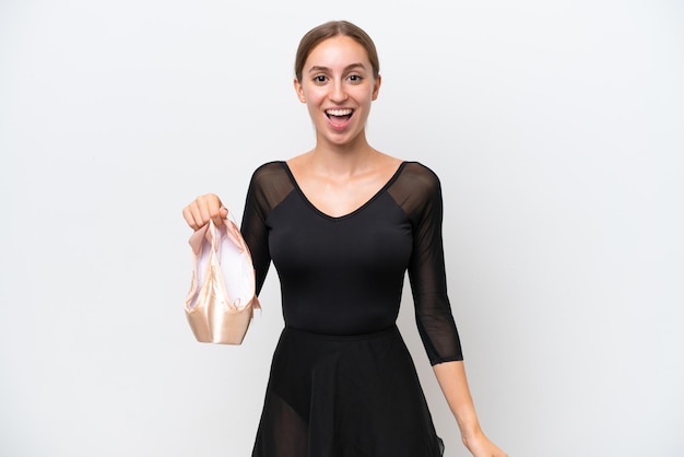 Young Caucasian woman practicing ballet isolated on white background with surprise facial expression