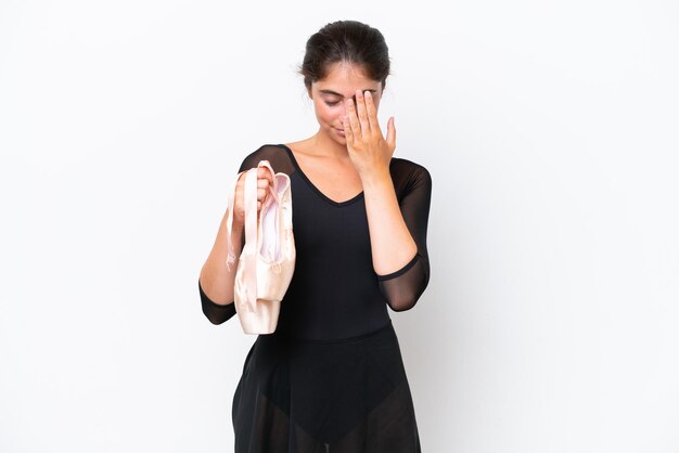 Young caucasian woman practicing ballet isolated on white background with tired and sick expression