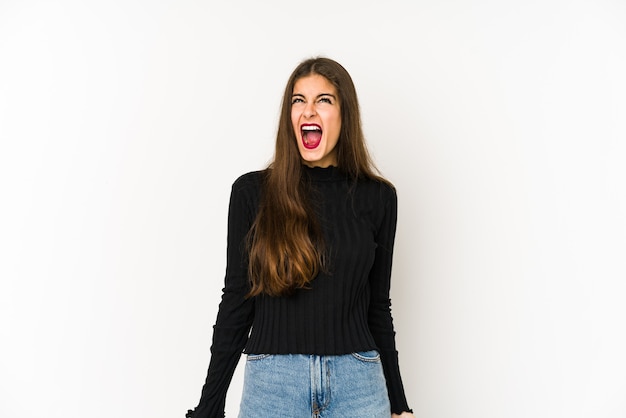 Young caucasian woman shouting very angry, rage concept, frustrated.