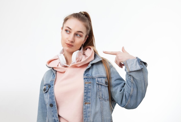 Young Caucasian woman showing finger at herself on white background