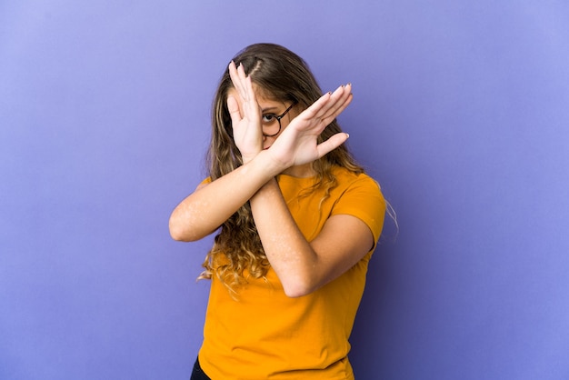 Young caucasian woman stop gesture isolated