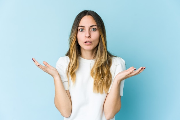 Young caucasian woman surprised and shocked.