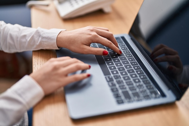 Young caucasian woman using laptop at office