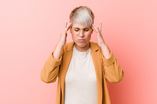 Young caucasian woman wearing a casual business clothes touching temples and having headache.