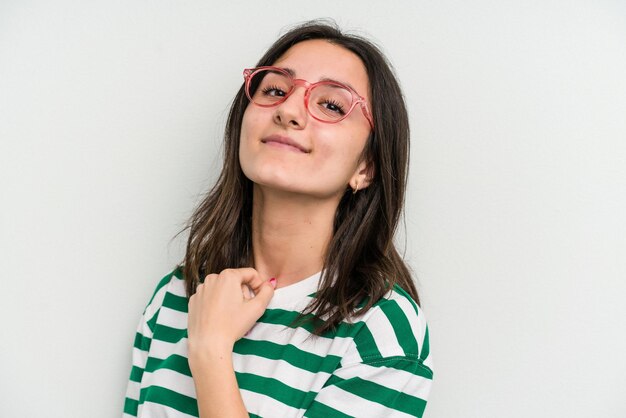 Young caucasian woman wearing a glasses isolated on blue background