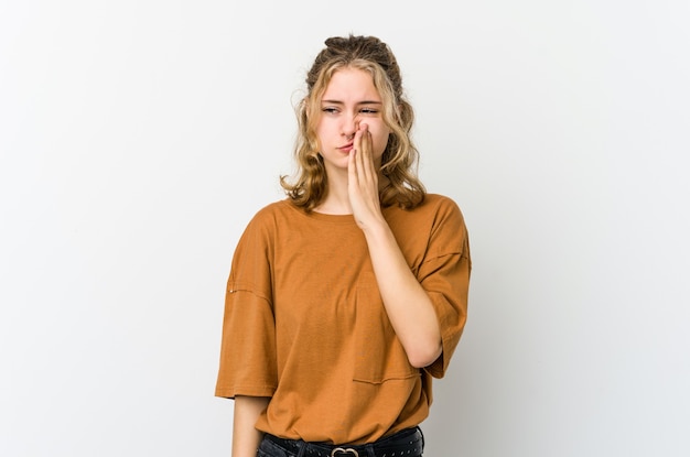 Young caucasian woman on white backrgound having a strong teeth pain, molar ache.