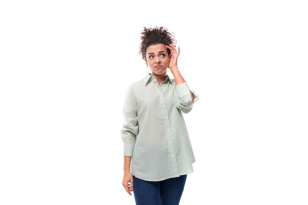 Young caucasian woman with black curly hair doubts about making a decision