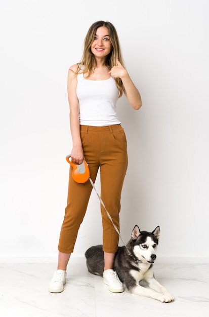 Young caucasian woman with her dog