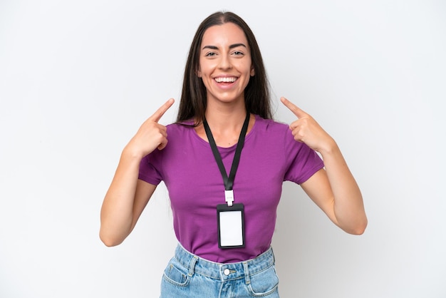 Young caucasian woman with ID card isolated on white background giving a thumbs up gesture