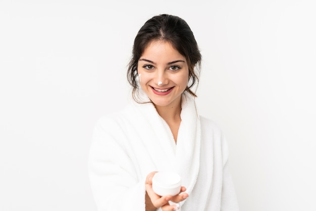 Young caucasian woman with moisturizer and offering it