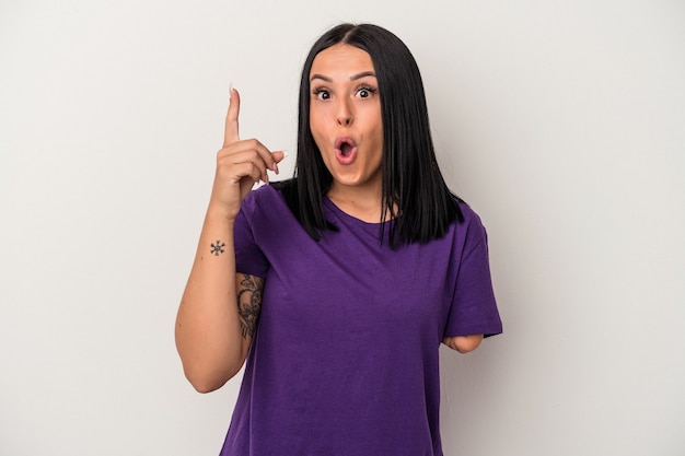 Young caucasian woman with one arm isolated on white background having an idea, inspiration concept.