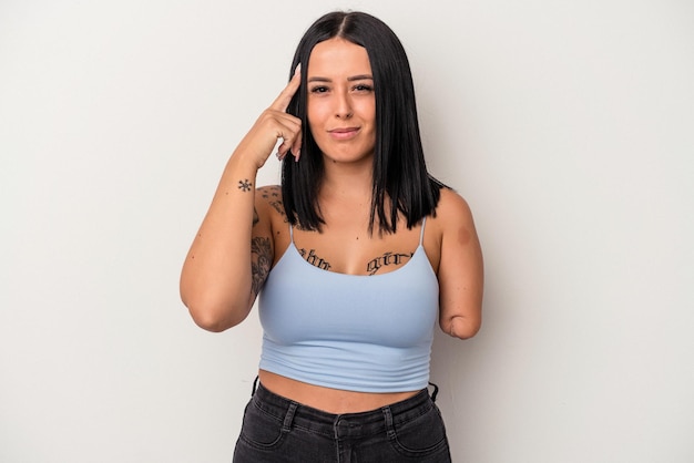 Young caucasian woman with one arm isolated on white background pointing temple with finger, thinking, focused on a task.