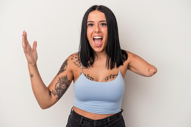 Young caucasian woman with one arm isolated on white background receiving a pleasant surprise, excited and raising hands.