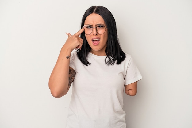 Young caucasian woman with one arm isolated on white background showing a disappointment gesture with forefinger.