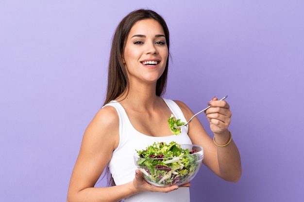 Young caucasian woman with salad