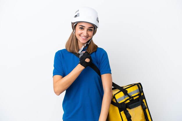 Young caucasian woman with thermal backpack isolated on white background celebrating a victory