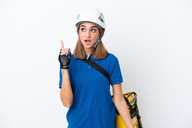 Young caucasian woman with thermal backpack isolated on white background thinking an idea pointing the finger up