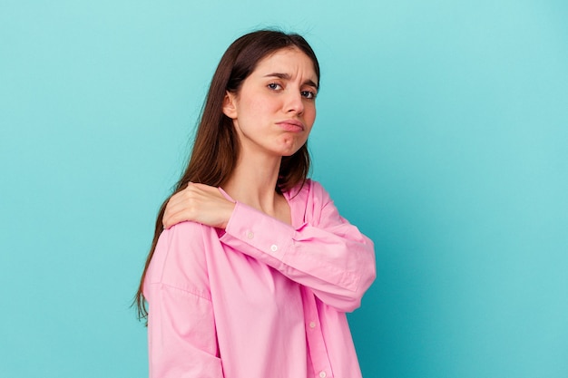 Young caucasian women isolated having a shoulder pain.