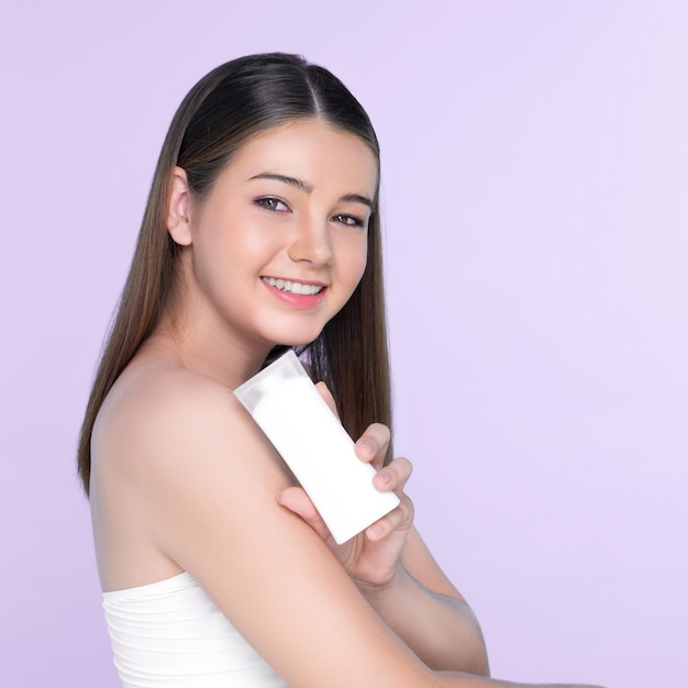 Young charming plump girl with natural beauty hold lotion tubel