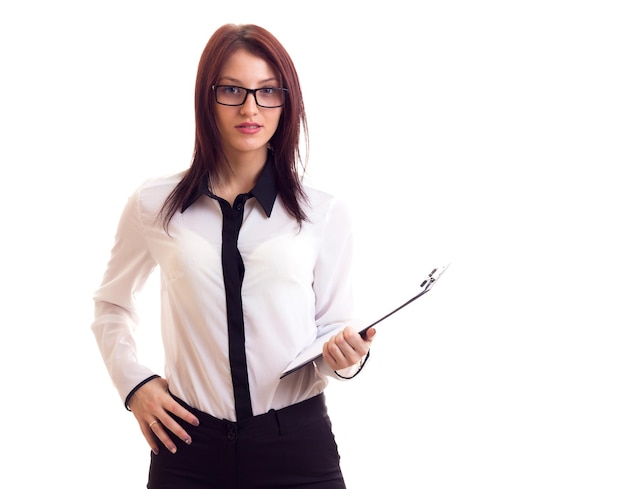 Young charming woman in white shirt with long dark hair holding black glasses in studio