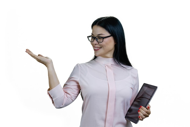 Young cheerful asian woman with tablet computer showing copy space Isolated on white background