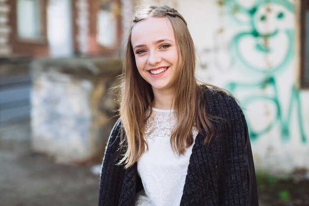 Young cheerful girl smiling at camera 