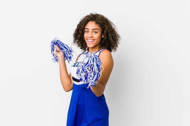 Young cheerleader woman isolated on white