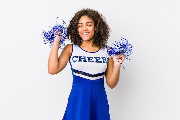 Young cheerleader woman isolated