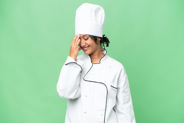 Young chef Argentinian woman over isolated background laughing