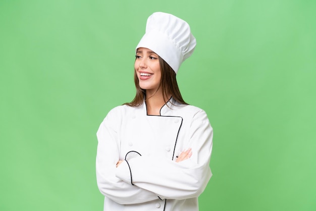 Young chef caucasian woman over isolated background happy and smiling