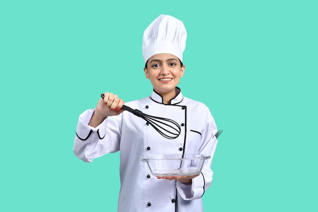 young chef girl white outfit holding mixture and spoon indian pakistani model