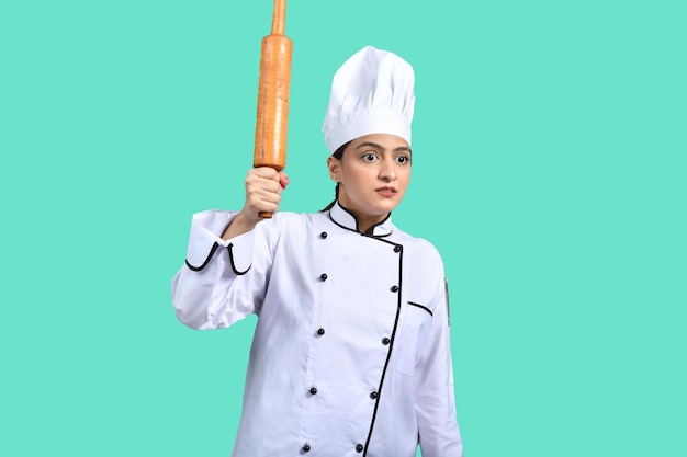 young chef girl white outfit holding rolling pin indian pakistani model