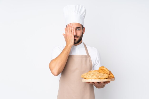 Young chef man over isolated wall